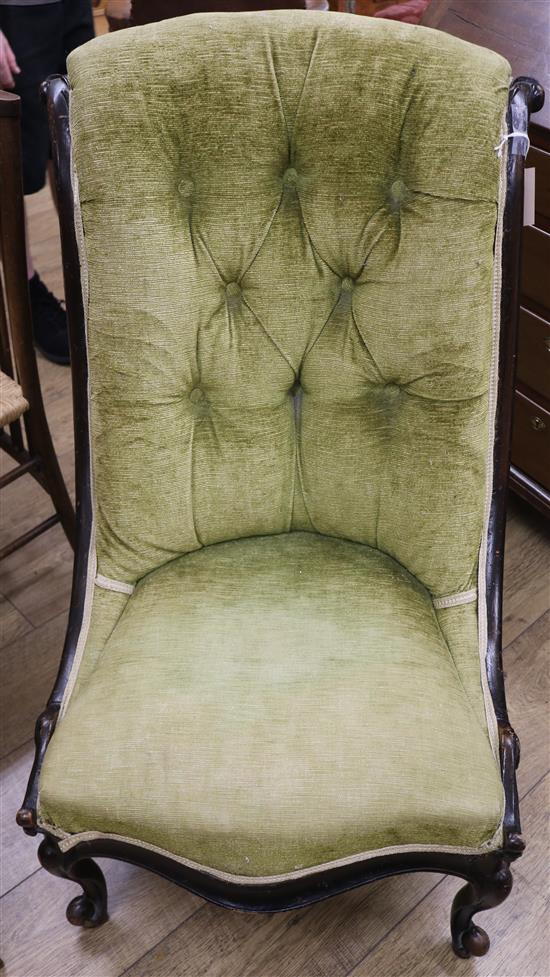 A Victorian walnut ladies easy chair